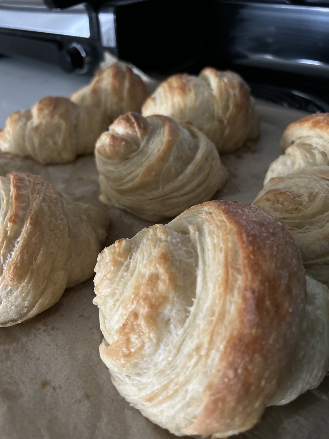 Golden laminated pastries with flaky layers